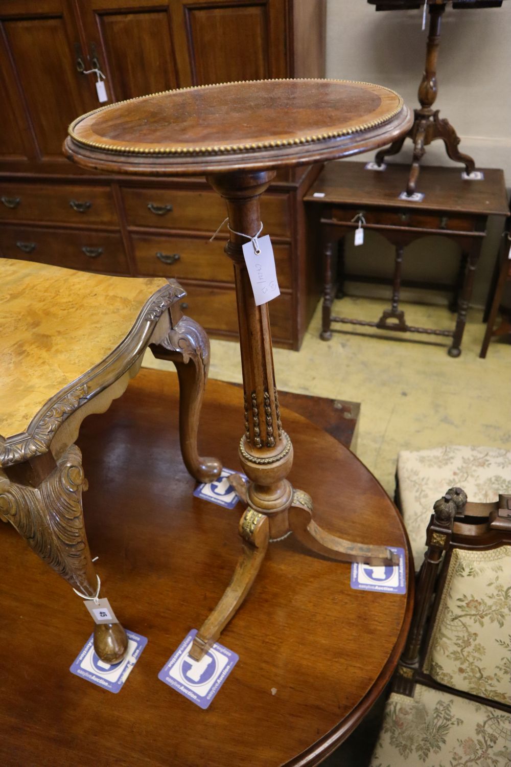 A brass mounted walnut tripod wine table and a Queen Anne style walnut low table, tripod table diameter 34cm height 75cm